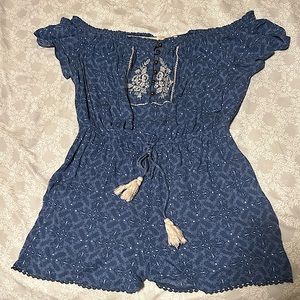A large blue romper from the brand, Rewind